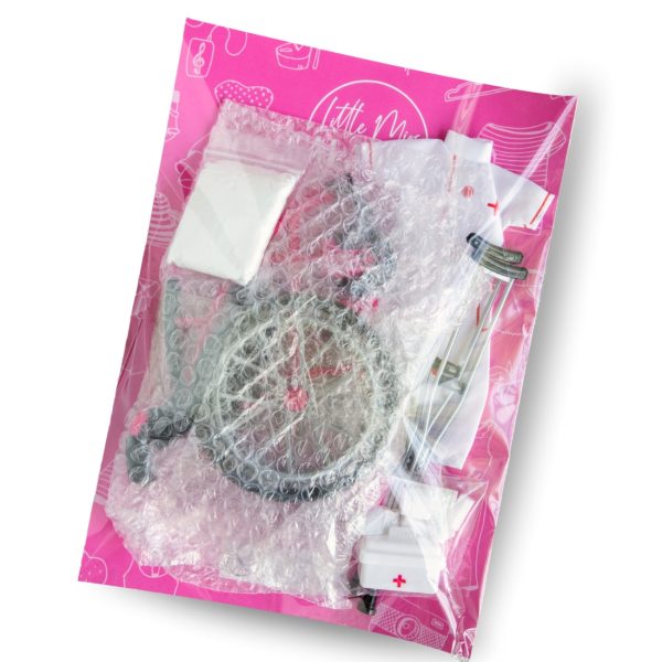 Packaging containing wheelchair, nurse outfit, foam clay, and accessories from the Little Miss Galavant Wheelchair & Nurse Care Set for 29cm dolls